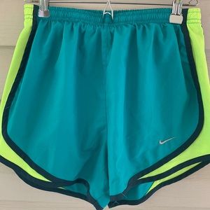 Green Nike running shorts